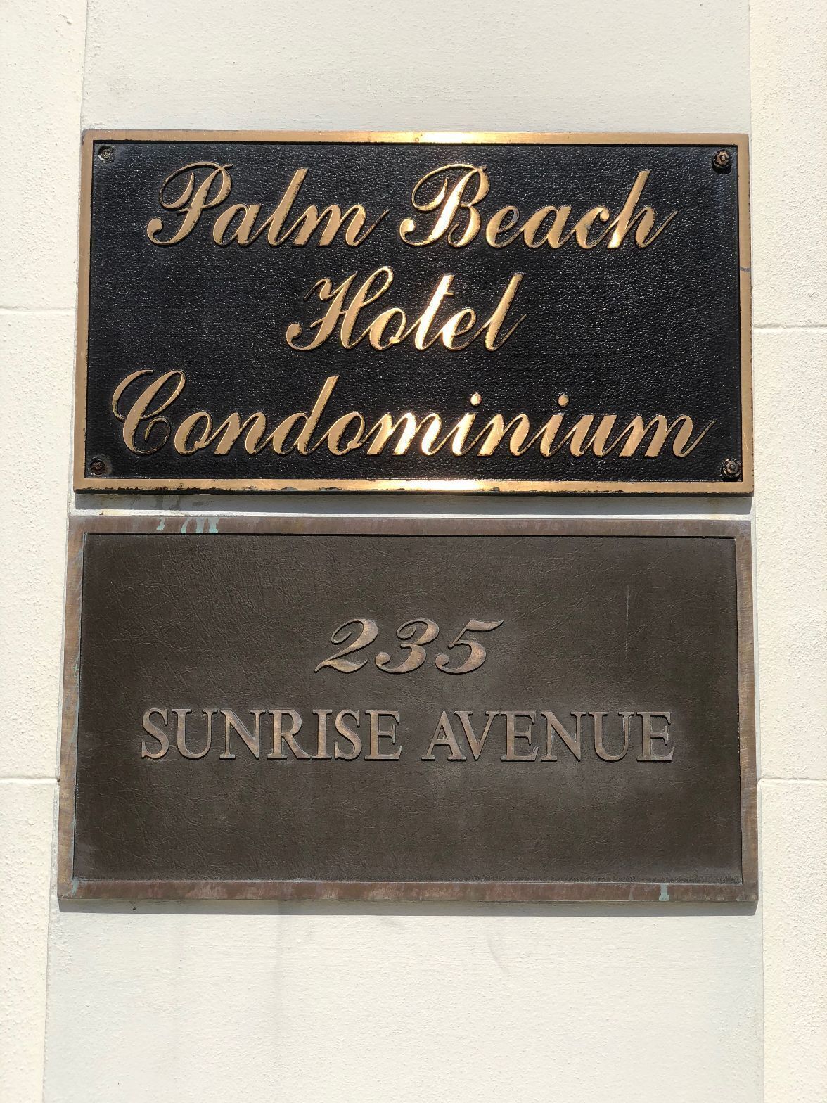 A sign for Palm Beach Hotel Condominium at 235 Sunrise Avenue.