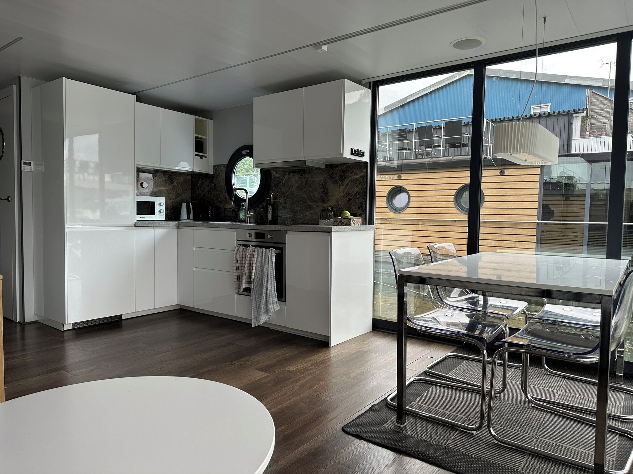 Houseboat with Lake view - Ramsvik | Private kitchen | Full-size fridge, microwave, oven, stovetop