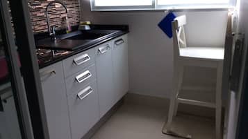 Fridge, microwave, stovetop, cookware/dishes/utensils