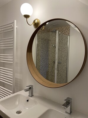 Shower, hair dryer, towels, toilet paper