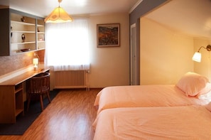 Premium bedding, pillow-top beds, desk, laptop workspace