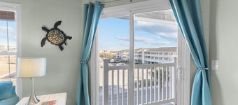 Spacious Top-Floor Condo w/ Pool, Elevator, Views; Walk to Beach and Town!