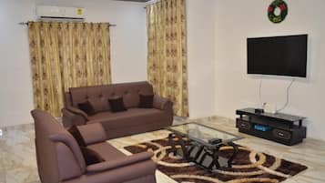 Deluxe Apartment | Living area | Smart TV