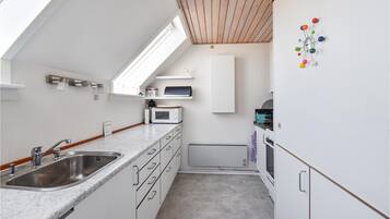 Fridge, stovetop, dishwasher, coffee/tea maker