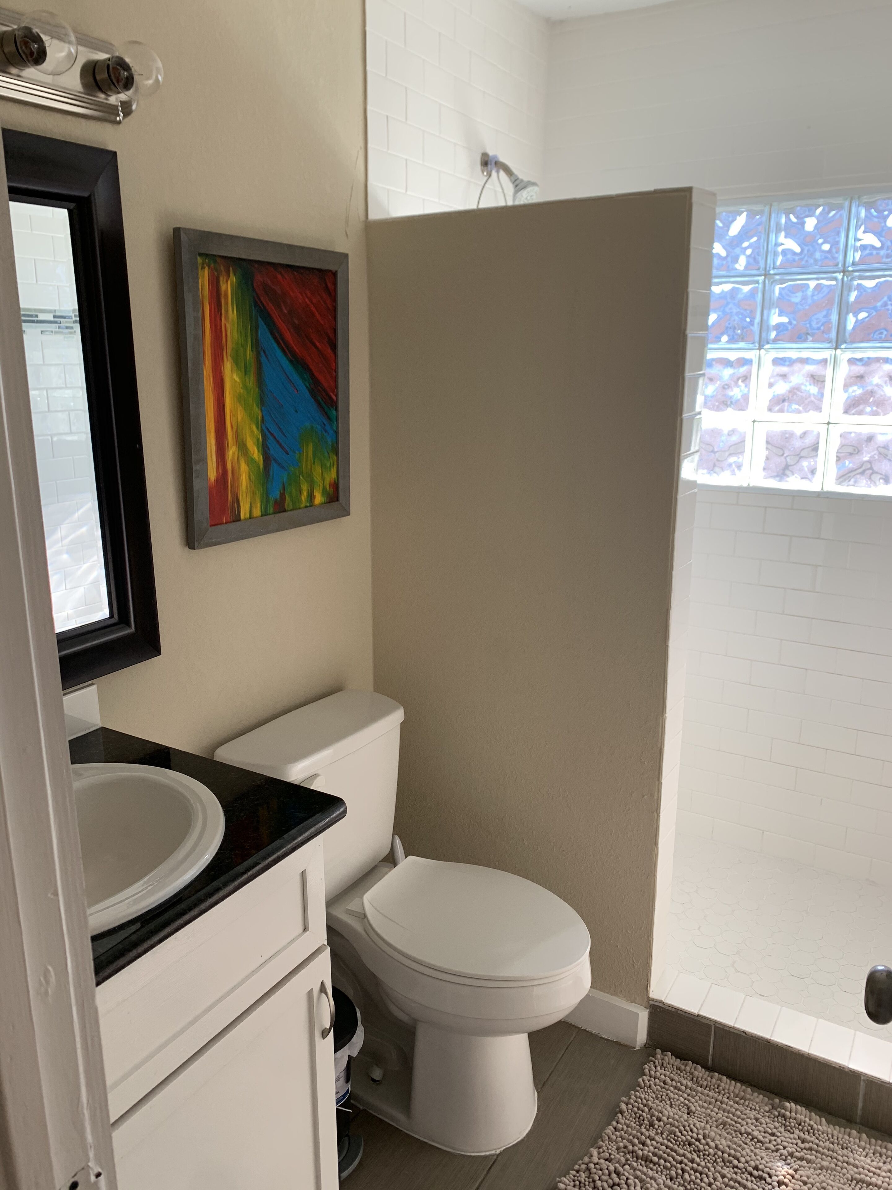 Shower, hair dryer, towels, toilet paper