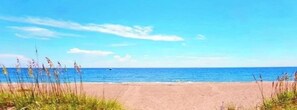On the beach, sun loungers, beach towels