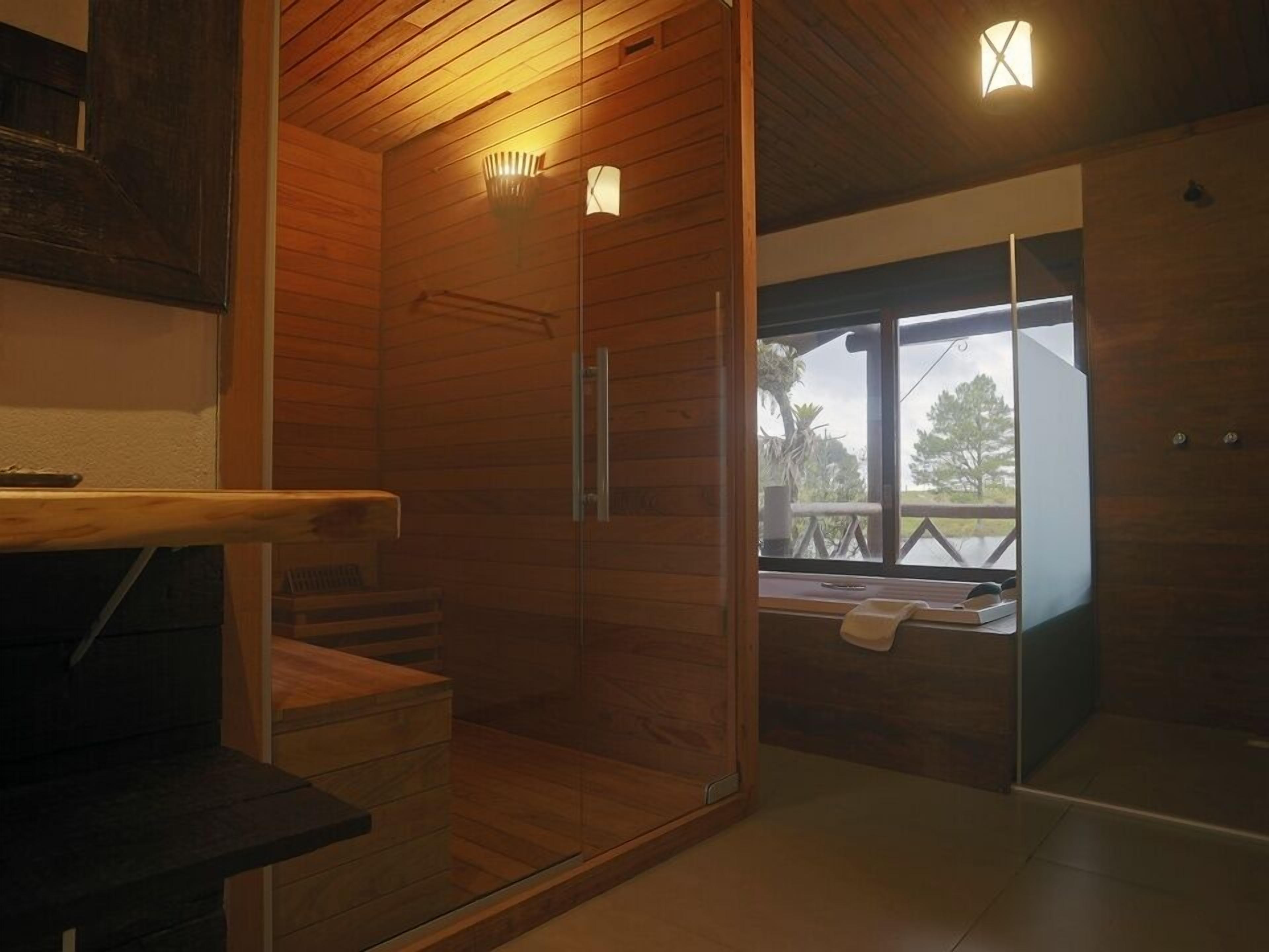 Bungalow by the Water | Bathroom | Shower, rainfall showerhead, free toiletries, hair dryer