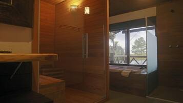 Bungalow by the Water | Bathroom | Shower, rainfall showerhead, free toiletries, hair dryer