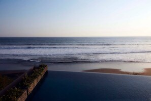 A coastal view with a beach and a calm sea. - Brand new absolute beachfront retreat (east selemadeg)