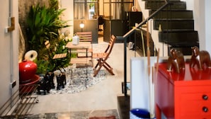 A modern interior with a staircase, a dining area, and a kitchen. - 87 Oldtown @ River Pier (Bangkok)
