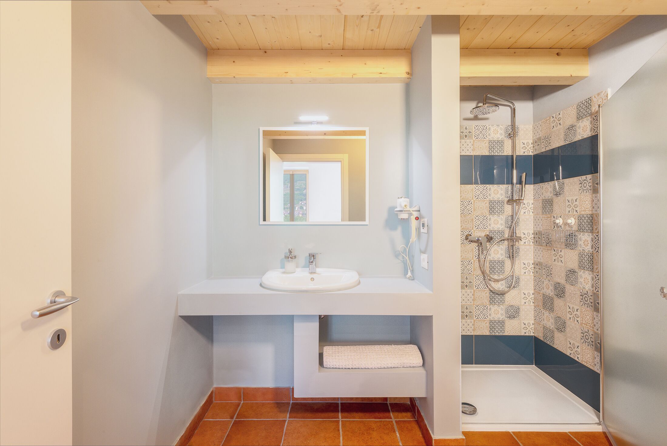 Shower, hair dryer, soap, toilet paper