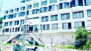 A multi-story building with balconies and large windows. - Grand Heights Hotel (Murree)