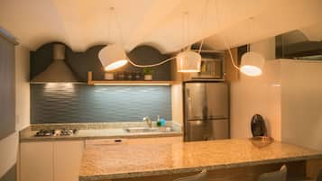 Fridge, microwave, coffee/tea maker, cookware/dishes/utensils