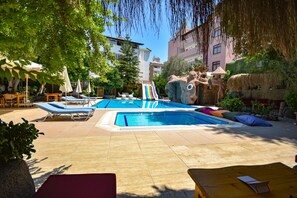 Outdoor pool, open 9:00 AM to 6:00 PM, pool loungers