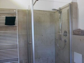 Shower, hair dryer, towels, toilet paper