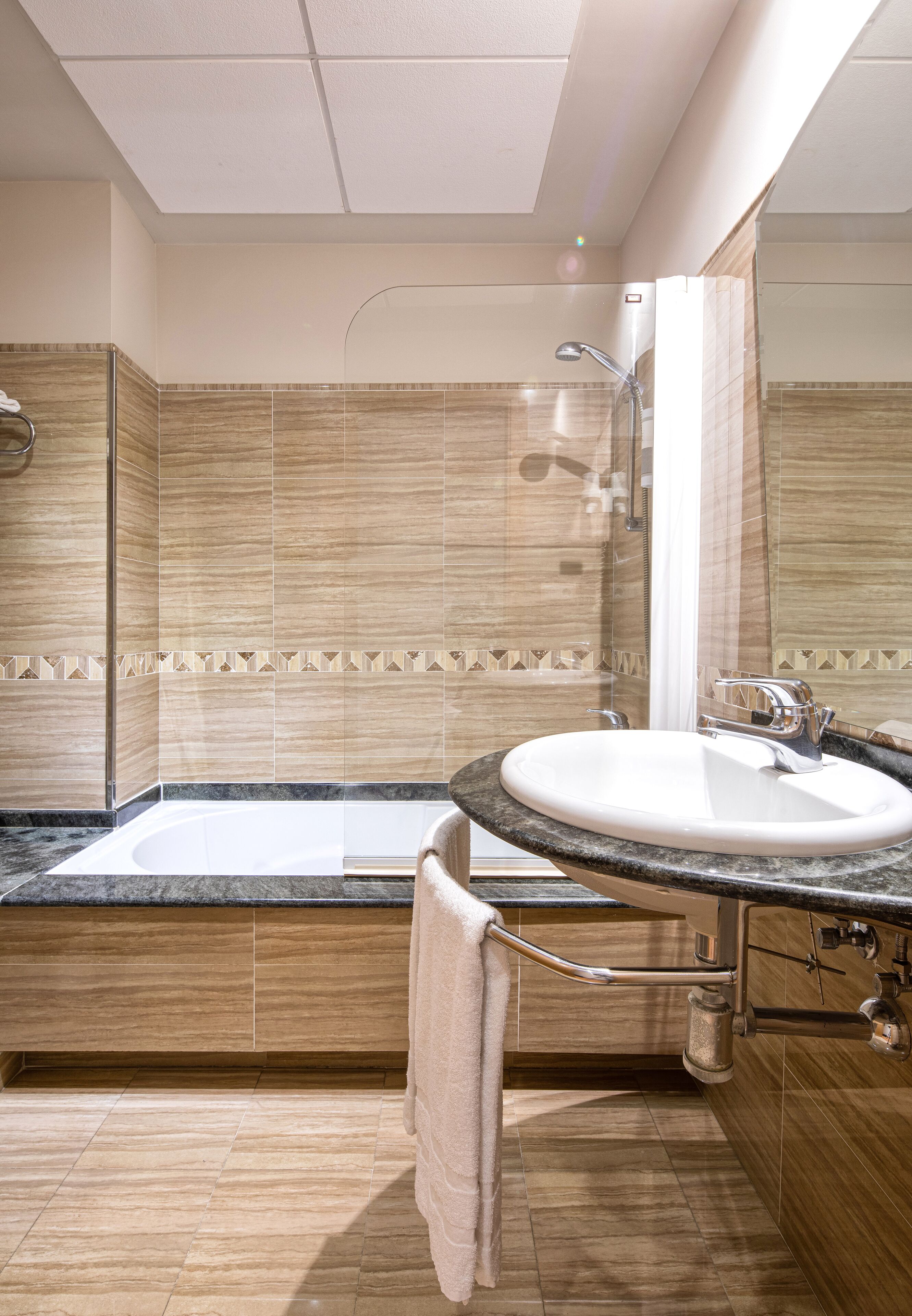 designer toiletries, hair dryer, bidet, towels