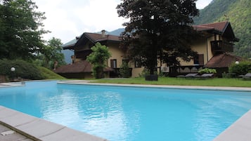 Seasonal outdoor pool, open 9:00 AM to 6:00 PM, sun loungers