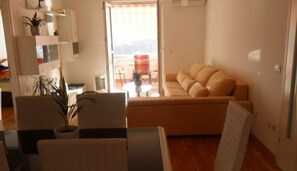Apartment, Terrace, Sea View | Living area | Flat-screen TV