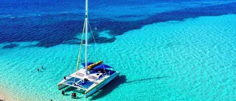 On the beach, sun loungers, beach towels