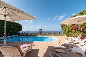 Outdoor pool, a heated pool, pool loungers