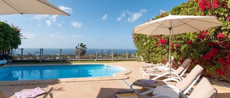 Outdoor pool, a heated pool, pool loungers