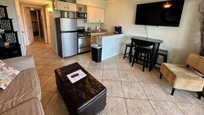 A compact living space with a kitchenette, a dining area, and a seating area. - Beach Happy!-Nice ocean view Hilton Head Villa (Hilton Head Island)