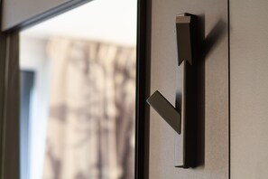 A modern door handle with a sleek, minimalist design. - B&B HOTEL Paris Meudon Vélizy (Meudon)