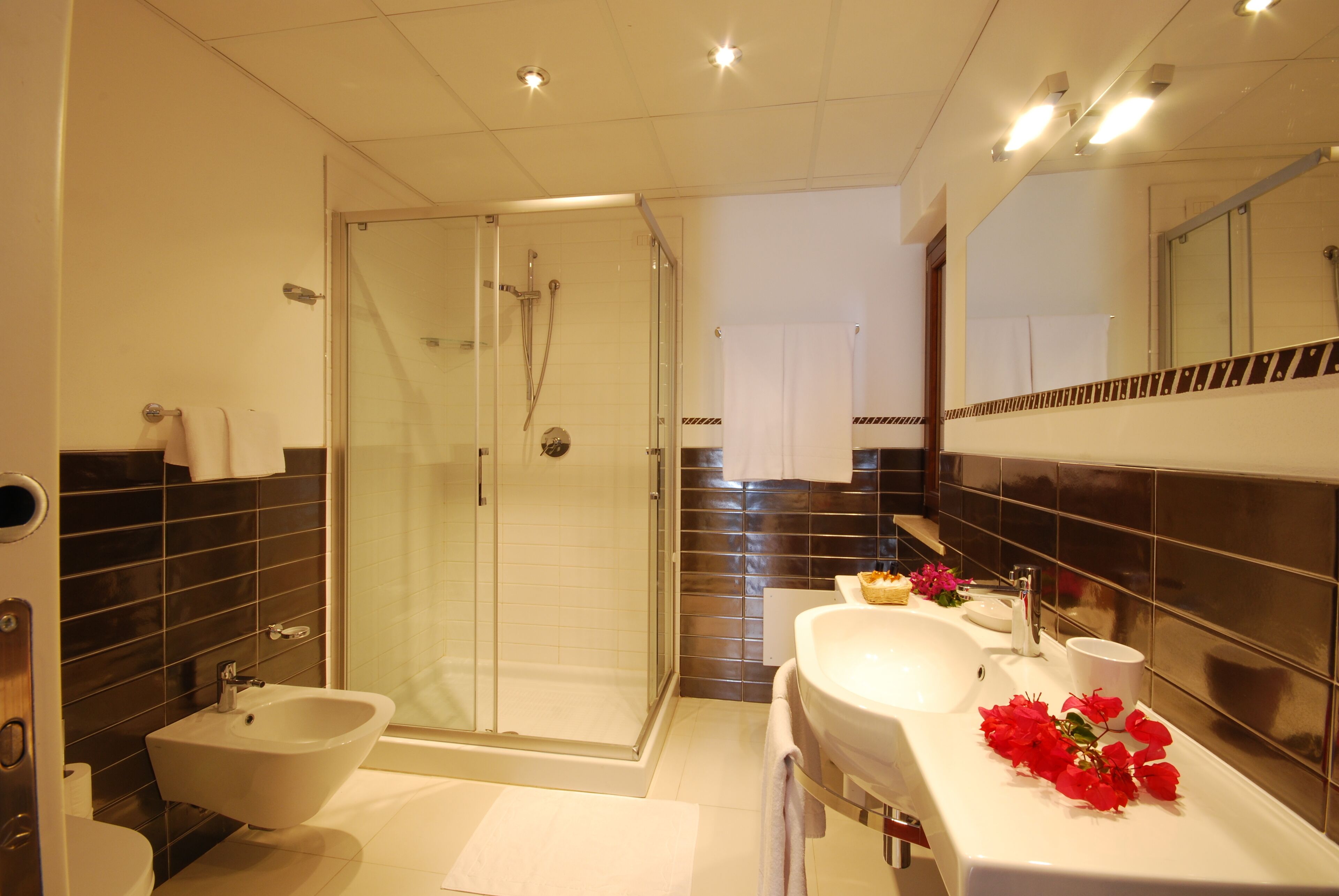 quadruple room | bathroom | shower, rainfall showerhead, free toiletries, hair dryer