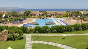 Seasonal outdoor pool, open 9:00 AM to 7:00 PM, pool umbrellas