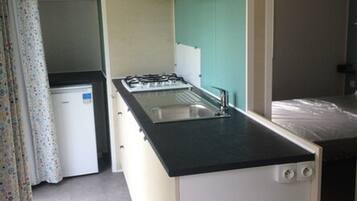 Mobile Home, Multiple Beds | Private kitchen | Mini-fridge, microwave, stovetop, coffee/tea maker