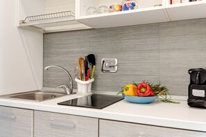 Fridge, microwave, stovetop, coffee/tea maker