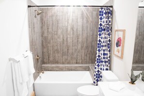Combined shower/tub, hair dryer, towels, soap