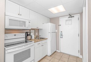 Fridge, microwave, coffee/tea maker, dining tables