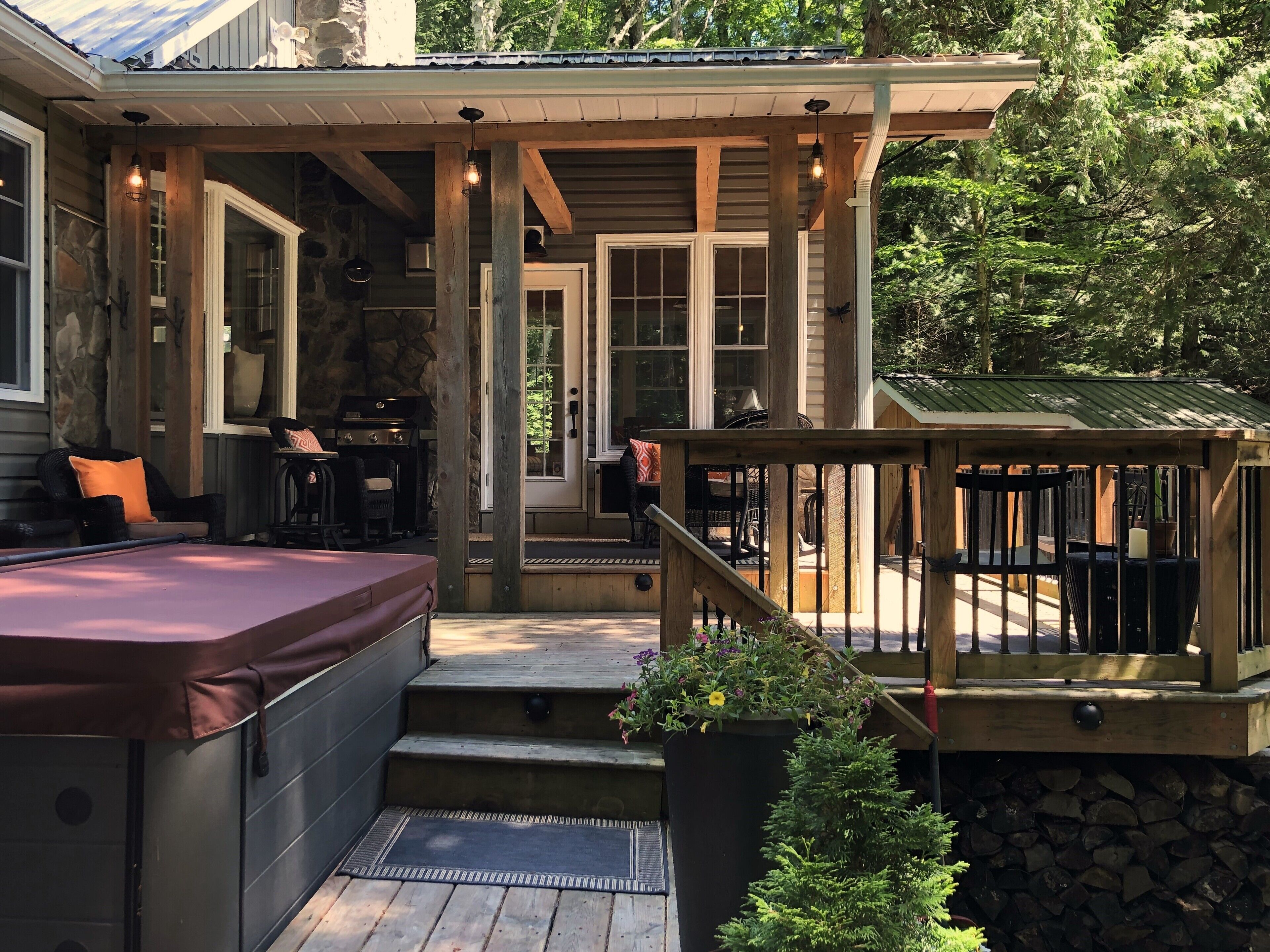 Deck and Hot tub leading to the front porch entrance.
