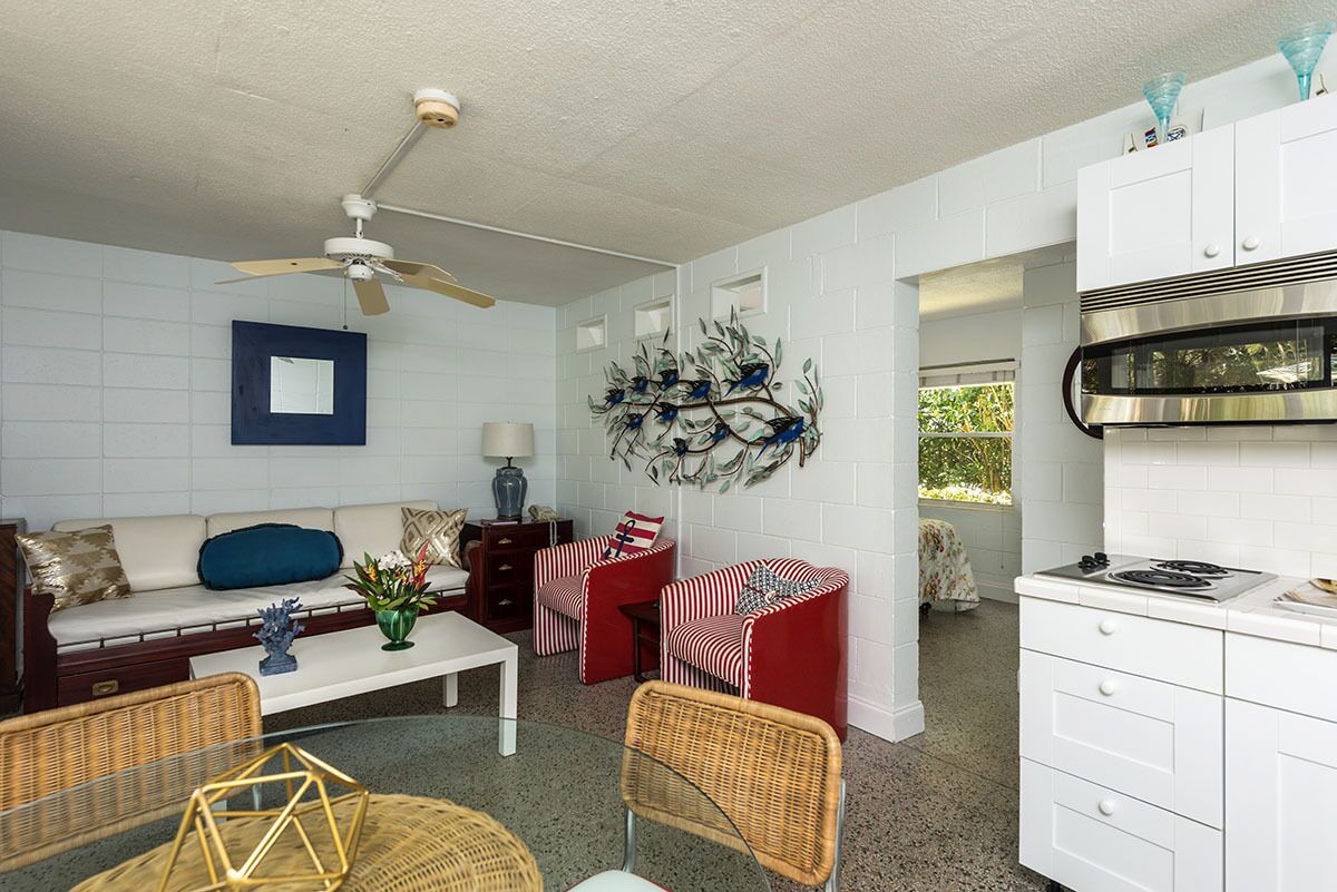 standard suite, 1 queen bed with sofa bed, pool view | living area | 32-inch lcd tv with cable channels, tv