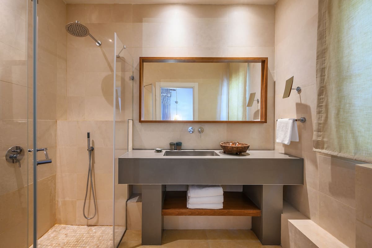 kedma family room | bathroom | shower, rainfall showerhead, free toiletries, hair dryer