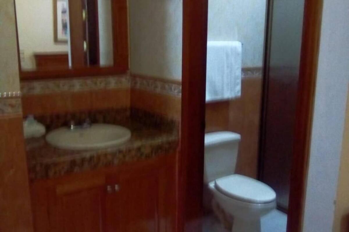 shower, rainfall showerhead, hair dryer, towels