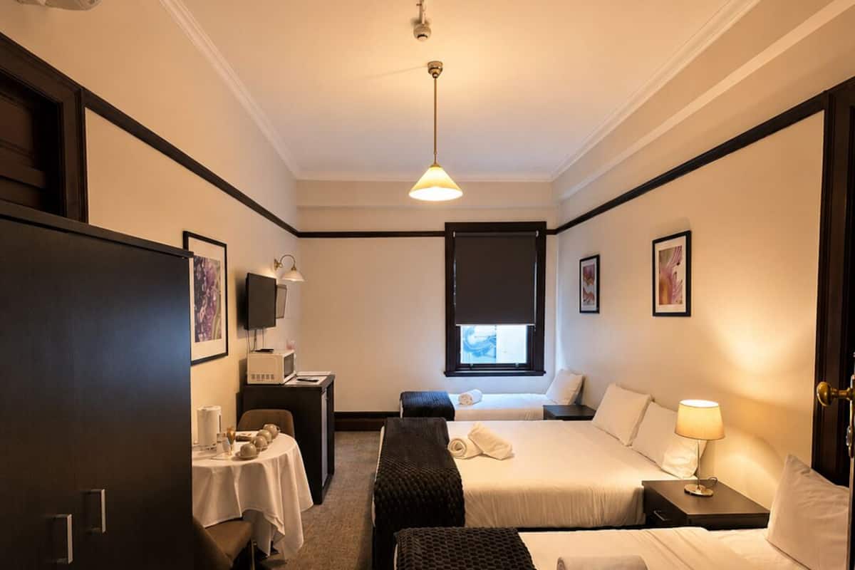Quadruple Room (1 Queen and 2 Single) with Shared Bathroom