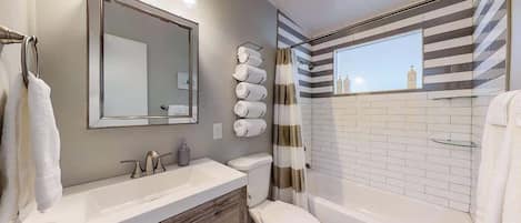 Bathtub, hair dryer, towels