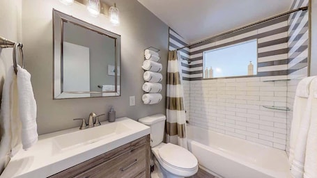 Bathtub, hair dryer, towels. Charming Family Home in Lovely Littleton