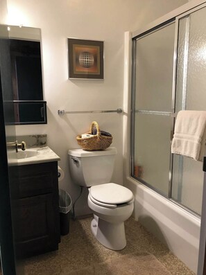Bathtub, hair dryer, towels, soap