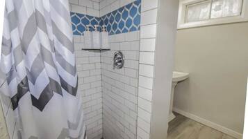 Bathtub, hair dryer, towels