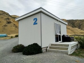 Cabin with 1 Queen and Bunk Bed | Blackout drapes, iron/ironing board, WiFi, bed sheets - Waimeha Camping Village (Cape Palliser)