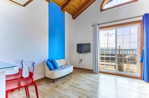 Edelweiss Room | Living area | Flat-screen TV