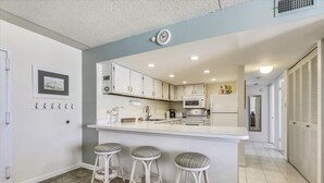 Condo, 3 Bedrooms | Private kitchen - East of the Sun 517 by Long & Foster (Fenwick Island)