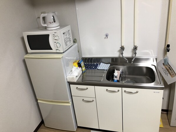 Apartment, 1 Bedroom | Private kitchen | Fridge, microwave, electric kettle, cookware/dishes/utensils