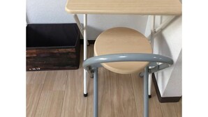 A corner desk with a wooden top and a metal frame, positioned against a white wall with a wooden floor. - Sapporo Apartment 1 (Sapporo)