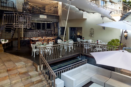 Terrace/patio. InnJoy Boutique Hotel