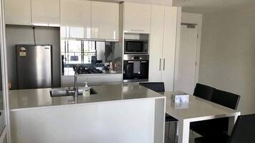 Apartment | Private kitchen | Full-size fridge, microwave, oven, stovetop