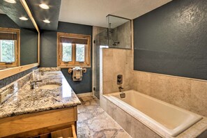 Bathtub, hair dryer, towels, soap